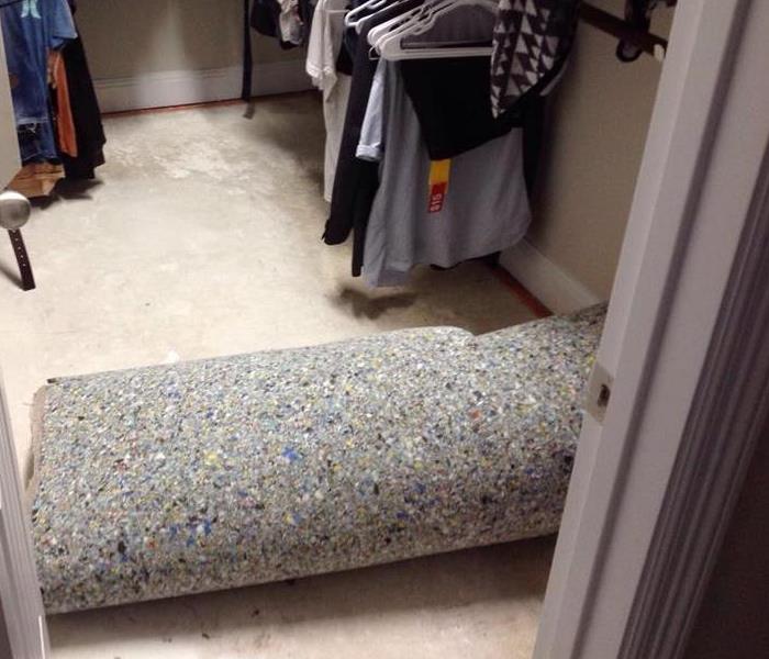 water damage on carpeting in closet