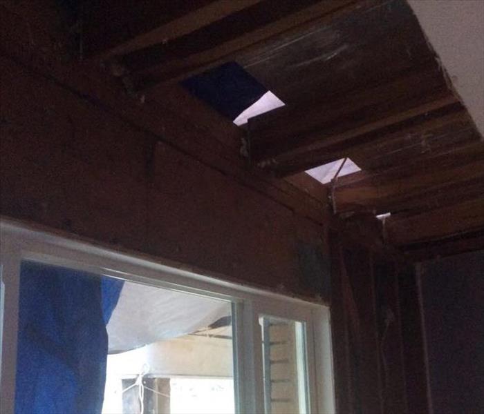 Exposed ceiling with water damage